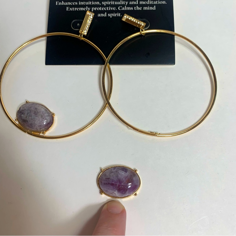 Junk jewelry. Pair of earrings but one has broken stone.
